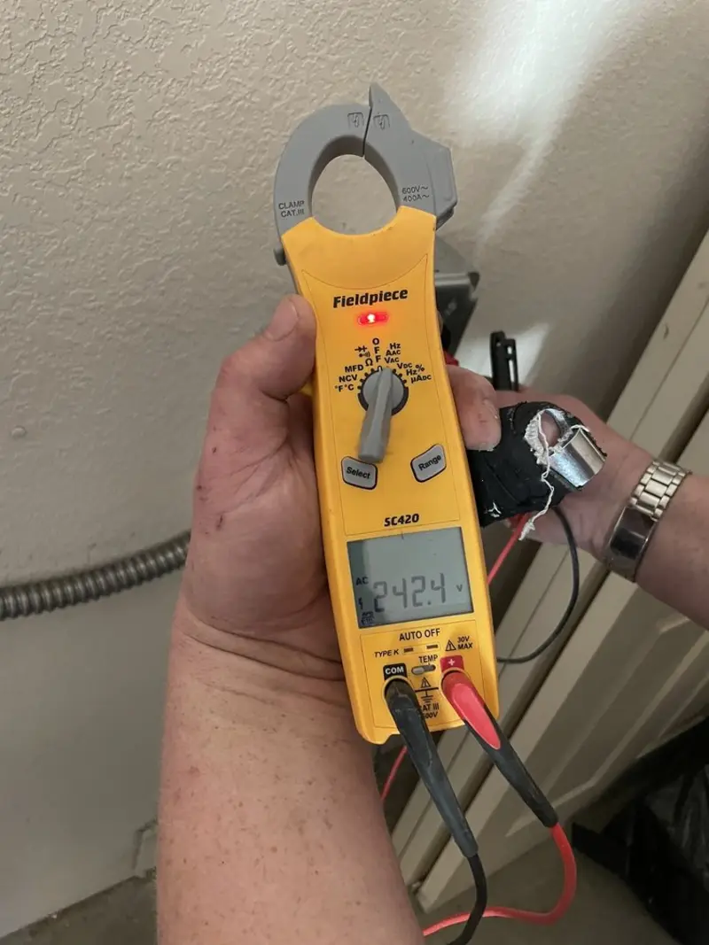 Voltage testing with clamp meter during Recessed Lighting Installation in Land O' Lakes